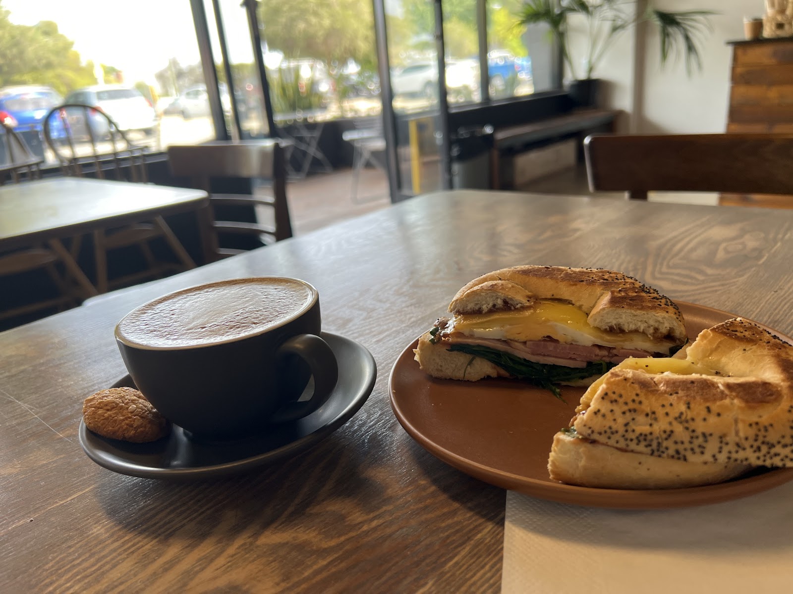 Coffee and a toasted bagel at Little Nolla Café, photographed by Drew Castle